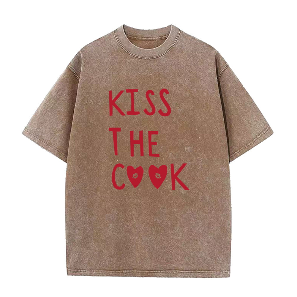 Brown t-shirt with red text 'KISS THE COOK' on a white background