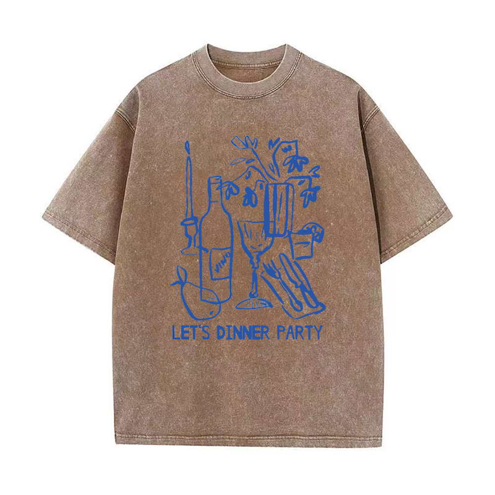 An oversized brown crew neck t-shirt with a graphic print that includes a wine bottle, glasses, and the text 'LET'S DINNER PARTY'.