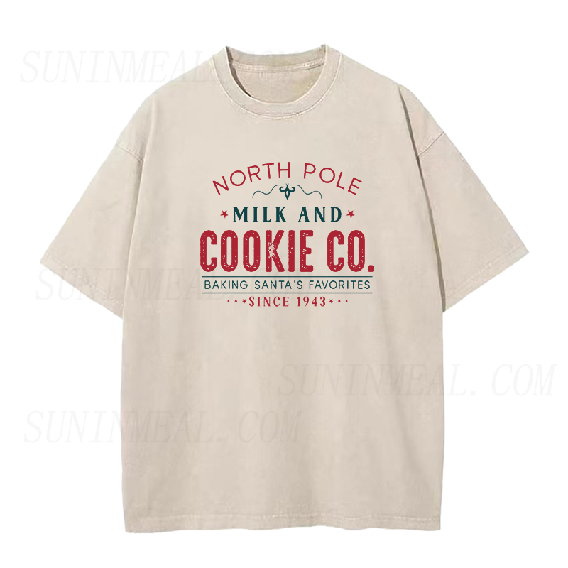 North Pole Milk And Cookie Co. Baking Santa’s Favorites Since 1943 Christmas Unisex Tee