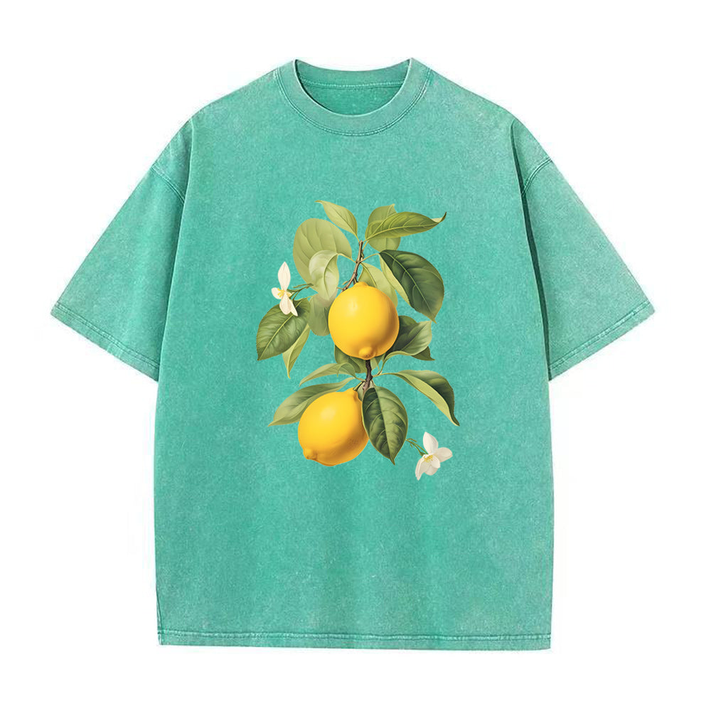 Green t-shirt with lemon graphic on a white background