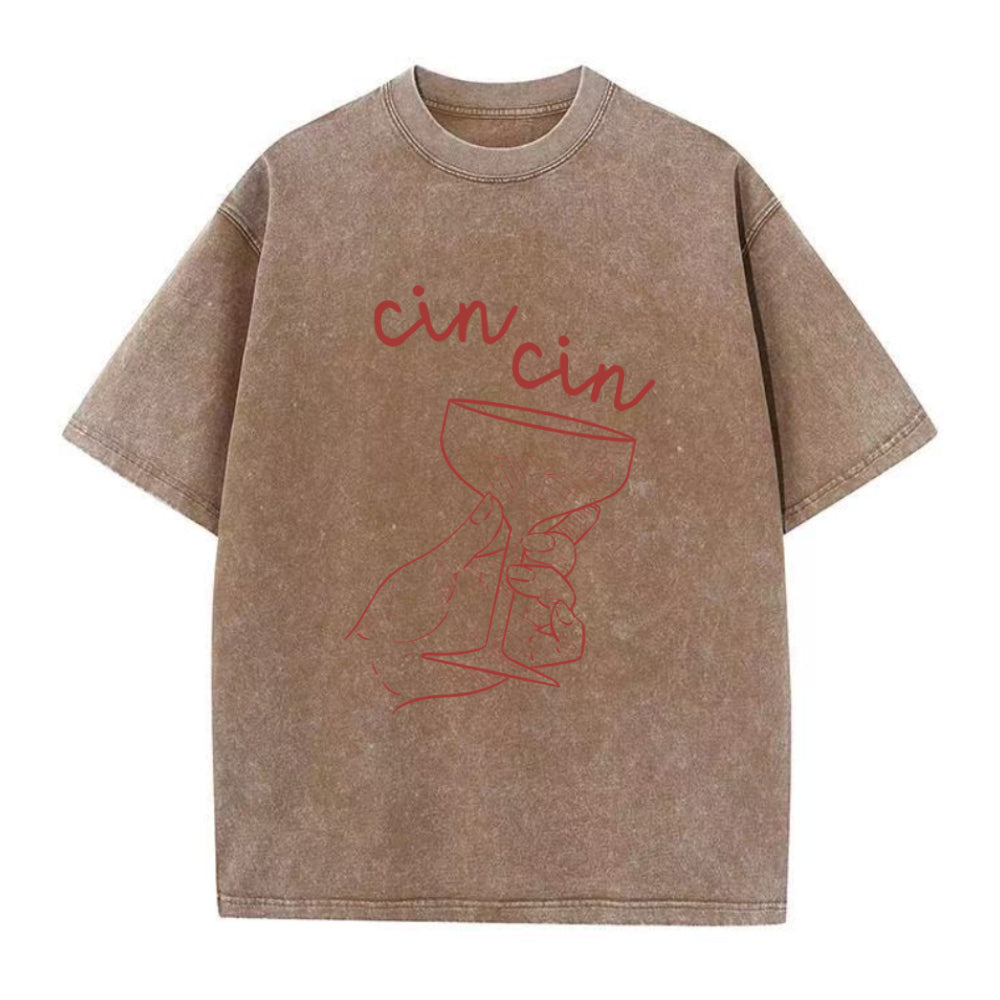 Brown t-shirt with red 'cin cin' text and wine glass graphic on a white background