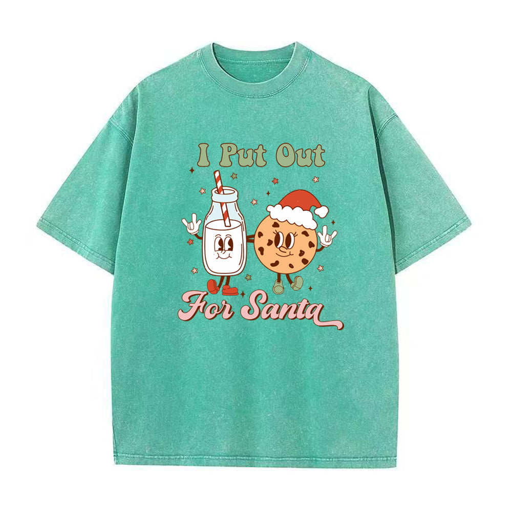 Green t-shirt with cartoon character design and text 'I Put Out For Santa' on a white background