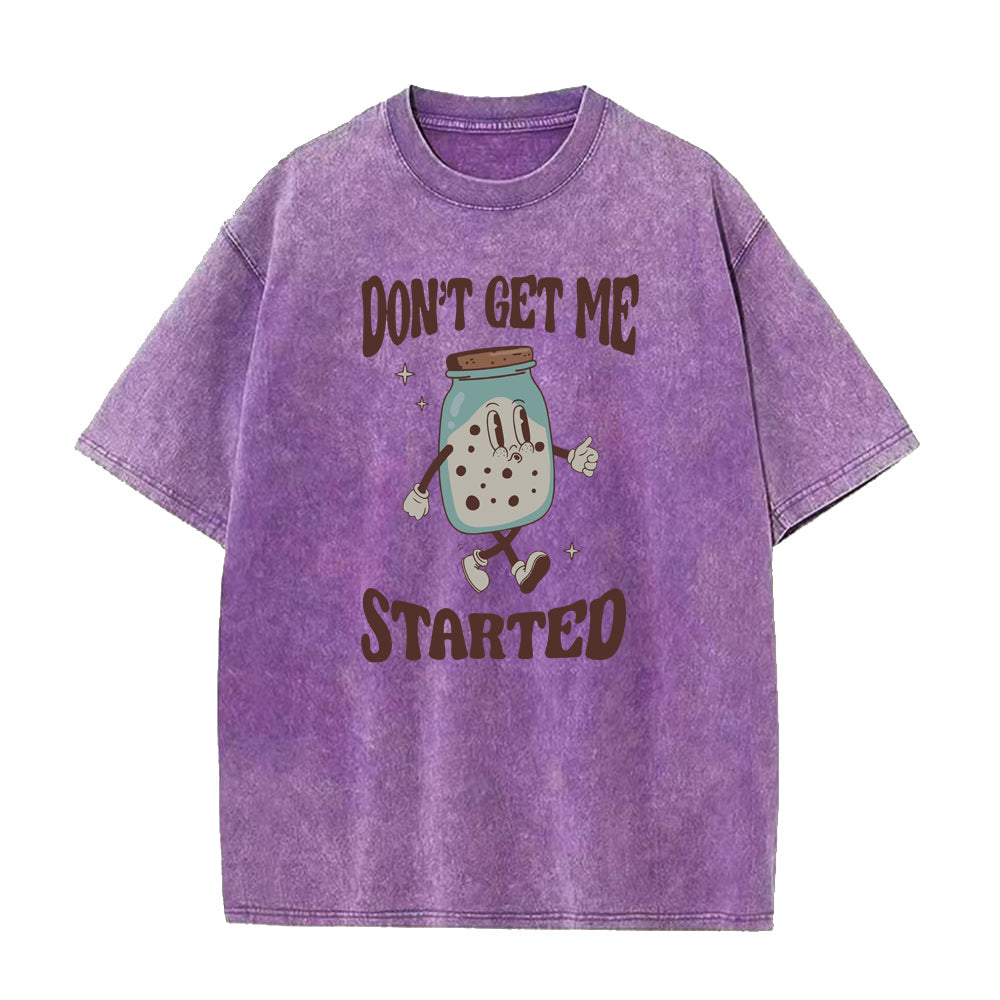 Purple t-shirt with cartoon character and text 'Don't Get Me Started' on a white background
