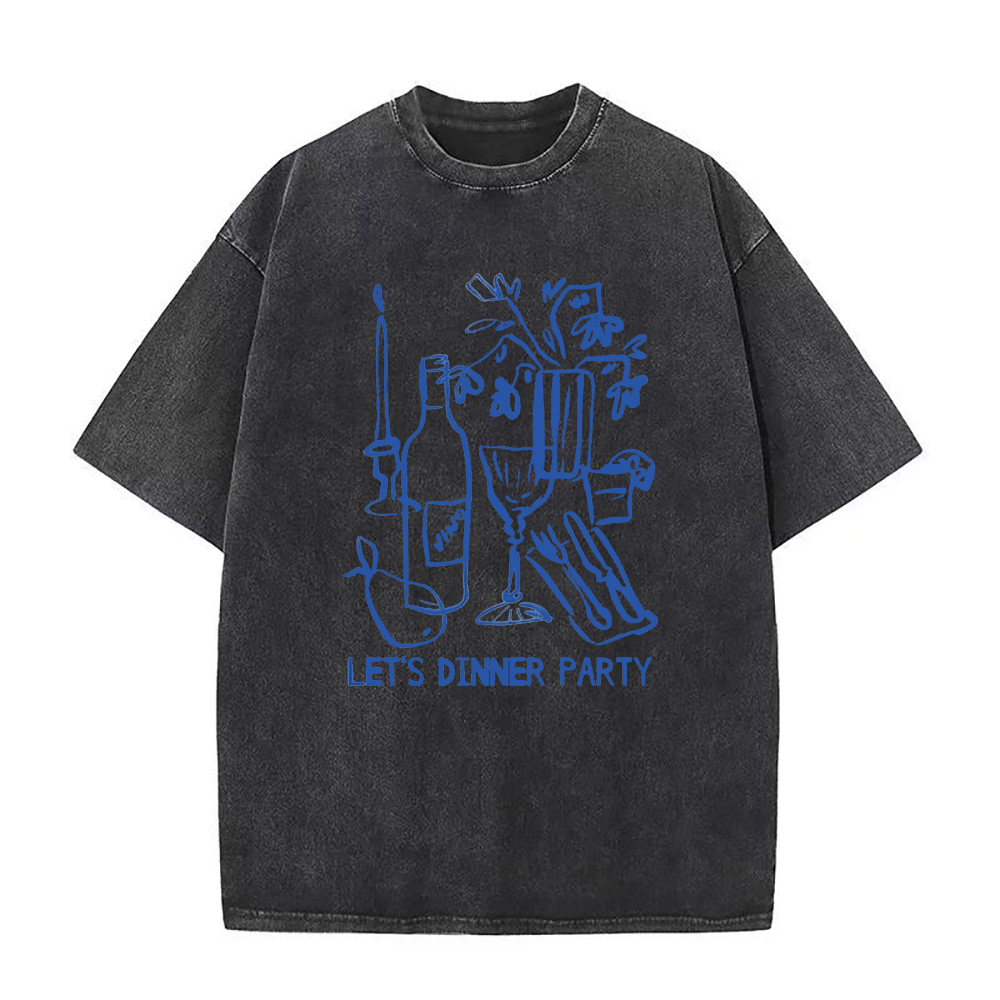 An oversized black crew neck t-shirt with a graphic print that includes a wine bottle, glasses, and the text 'LET'S DINNER PARTY'.