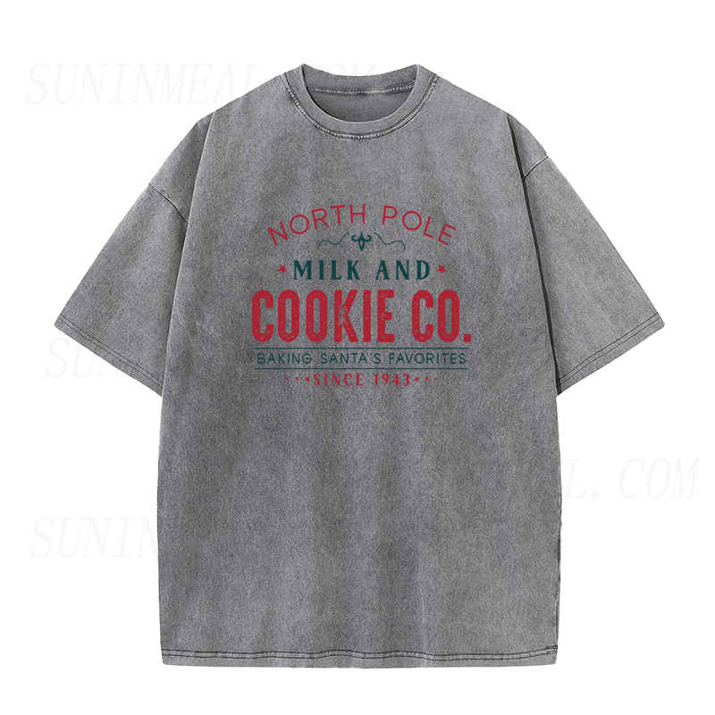 North Pole Milk And Cookie Co. Baking Santa’s Favorites Since 1943 Christmas Unisex Tee