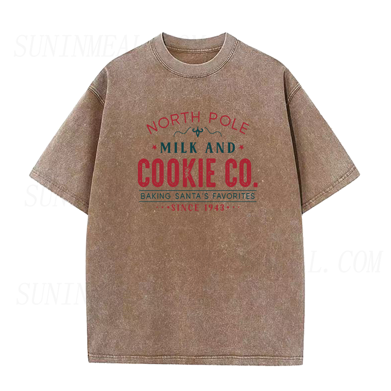 North Pole Milk And Cookie Co. Baking Santa’s Favorites Since 1943 Christmas Unisex Tee